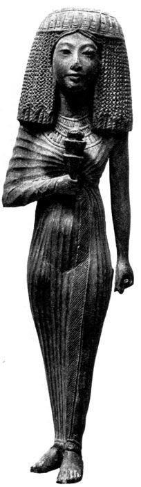 34. Ханонтон. Деревянная фигурка, XIX династия. Египетский музей, Каир. Знатная женщина с высоким париком, одета в каласирис из мягкой шелковой ткани.